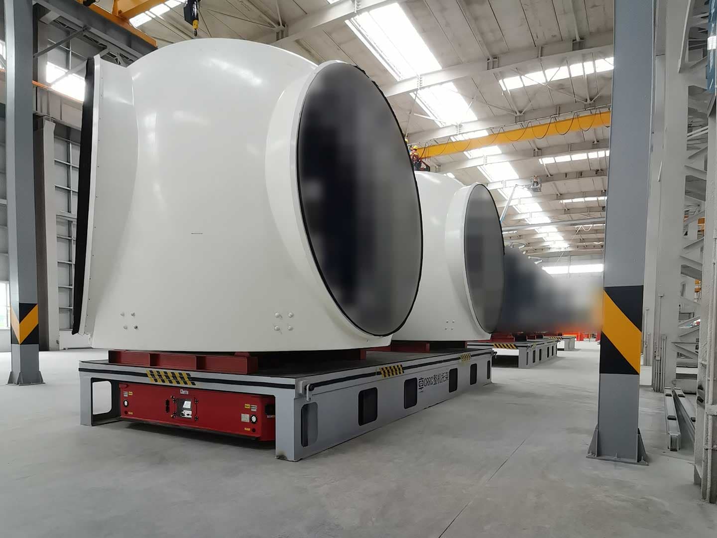 Four wheeled transport vehicles are used for the transportation of wind turbine nacelle components-2